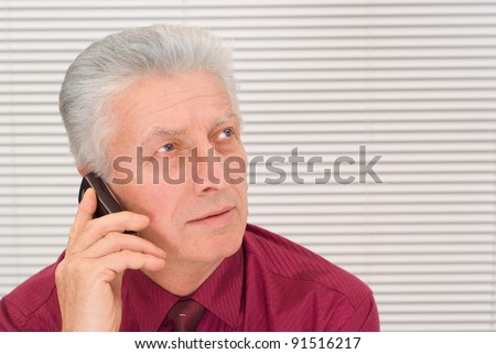 portrait of a cute old guy with phone