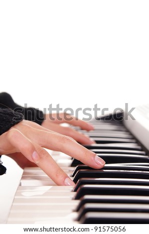 portrait of a cute fingers and piano keys