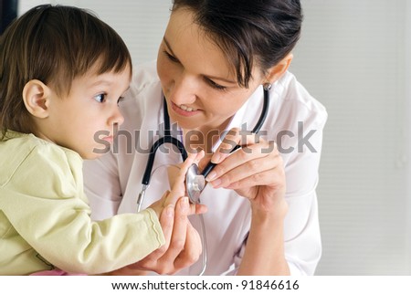 nice doctor with little girl on white
