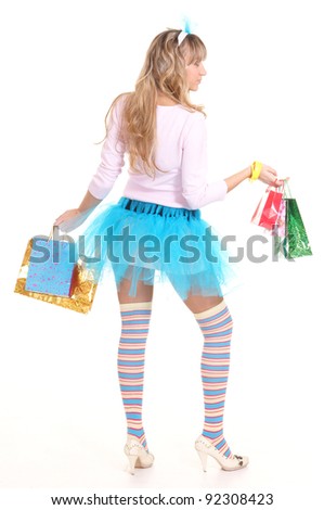 portrait of a nice girl in funny socks with holiday bags