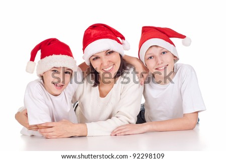 cute mom and her kids in santa hats