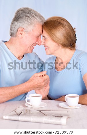 cute old couple at breakfast at table