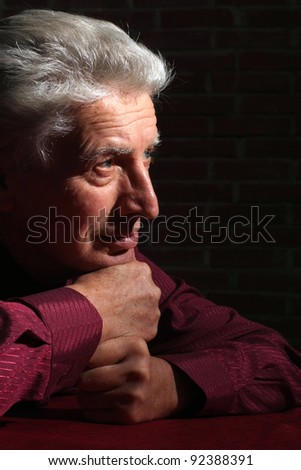 portrait of an old man in darkness