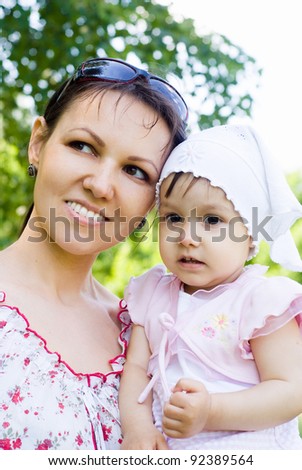 happy mom with her daughter at nature
