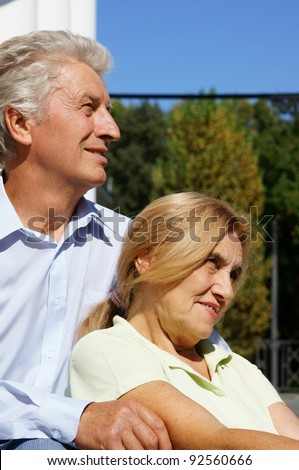 portrait of an old couple at street