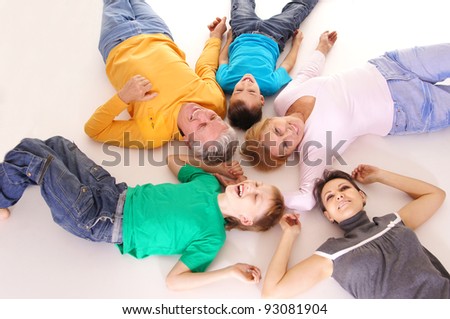 smiling cute people lying on the floor