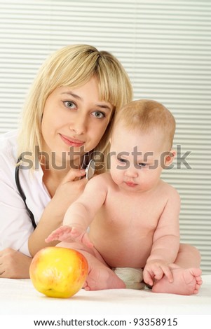 cute doctor and baby sitting at office