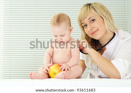 cute doctor and baby sitting at office