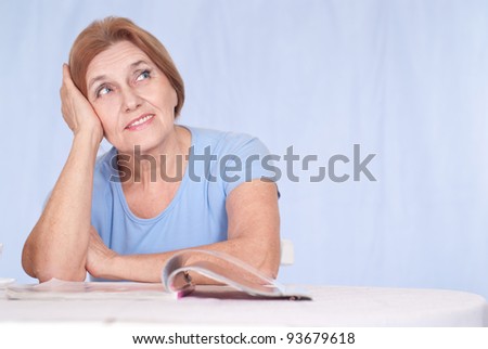 portrait of an old lady with magazine