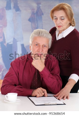 business man with a lady drinking coffee on a light background