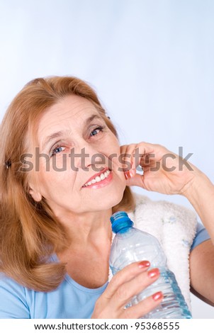 cute old woman with bottle of water