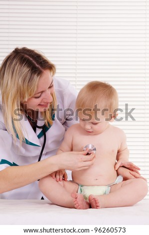 portrait of a nice doctor with baby