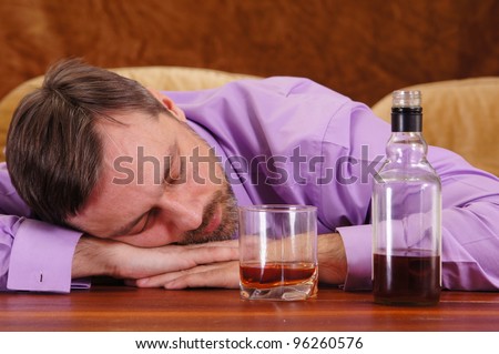 nice guy drinking whiskey at the table