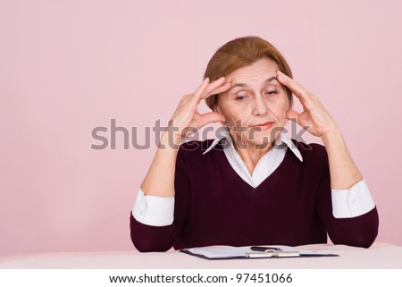 portrait of an aged worker with files