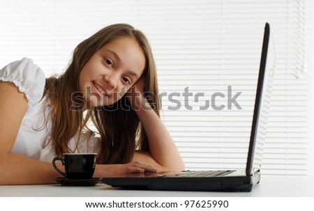 the woman at the computer sits on a isolate