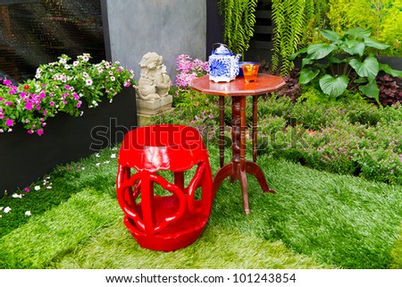 small garden with red chair decorate in chinese style