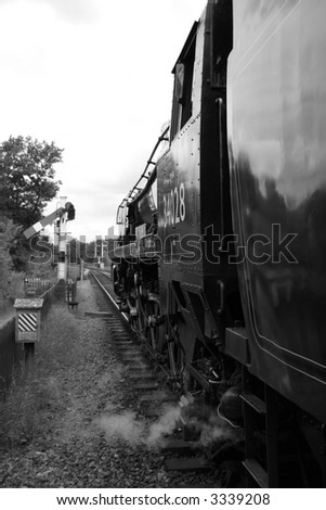 British steam engine in front of signals