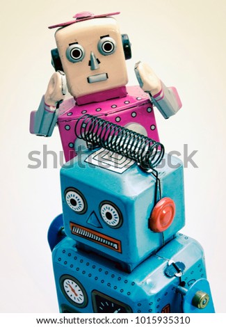 relationship troble concept with retro robot toys