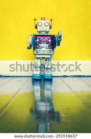 retro  robot toy on a wooden floor