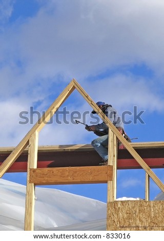 man working framing house