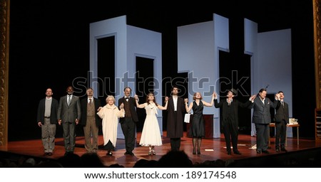 PARIS, FRANCE -Â?Â? MARCH  23, 2014: Isabelle Huppert (center in white dress), at  end of the representation of The False Confidences by Marivaux, at Odeon theater,  March 23, 2014,  in  Paris, France.