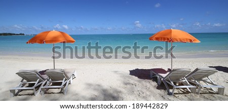 Parasols and lagoon on Mont-Choisy beach, Mauritius island, indian ocean
