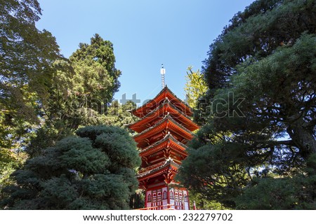 red  pagoda in a japanese garden