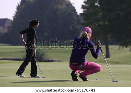 BUSSY SAINT-GEORGES GOLF COURSE, FRANCE - OCTOBER 14 :  Genuini (red pants) and Drummond (FRA) at Trophee Prevens, Ladies European Tour, october 14, 2010, at  Bussy Saint-Georges golf club, France.