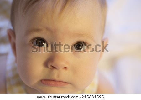 close-up of scared or confused expression on baby face