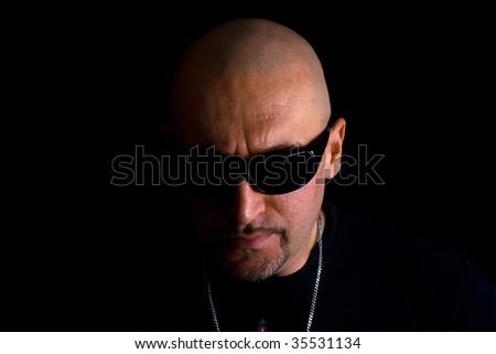 Close-up portrait of scary man with black glasses