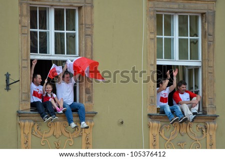 WROCLAW, POLAND - JUNE 16: fans in windows of flats in FANZONE before match Euro 2012 Poland - Czech Republic on June 16, 2012 in Wroclaw, Poland. Zone for the fans UEFA EURO Championship.