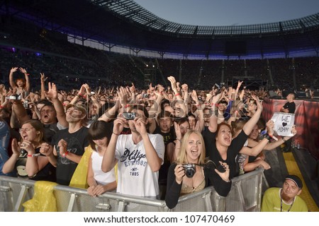 WROCLAW POLAND JULY 7 Concert Queen & Adam Lambert in the Rock Festival in Wroclaw on July 7 2012 in Wroclaw Poland The concert at the football stadium where they were Euro 2012 matches WROCLAW POLAND JULY 7 Concert Queen & Adam Lambert in the Rock Festival in Wroclaw on July 7 2012 in Wroclaw Poland The concert at the football stadium where they were Euro 2012 matches