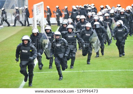 LUBIN, POLAND - FEBRUARY 28: Police maneuvers at the football stadium of Zaglebie Lubin on February 28, 2013 in Lubin, Poland.