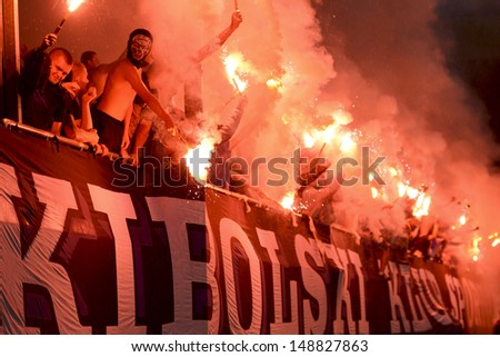 LUBIN, POLAND - AUGUST 4: Fans of Lech Poznan smoke flares during match Polish Premier League betwen KGHM Zaglebie Lubin - Lech Poznan (0:0) on August 4, 2013 in Lubin, Poland.
