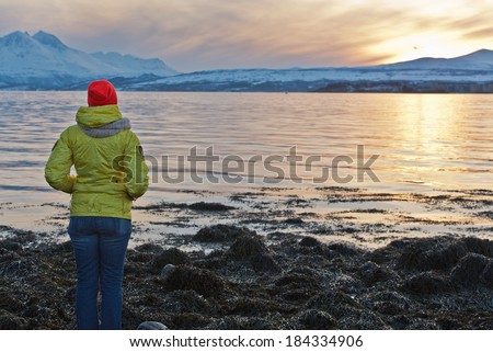 Woman looking ahead during sunset