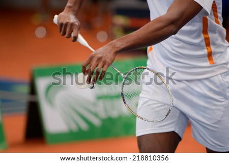 LUBIN, POLAND - SEPTEMBER 18, 2014: Virgil Soeroredjo serves during Polish Championship in Badminton - \