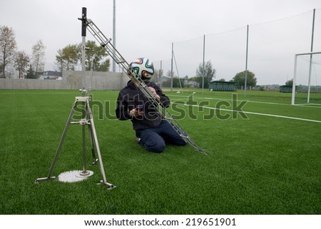 LUBIN, POLAND - SEPTEMBER 25, 2014: Tests of artificial turf made in order to get a certificate FIFA 2 Star.