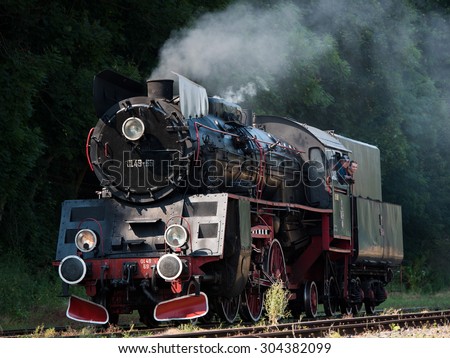 MIEDZYCHOD, POLAND - AUGUST 8, 2015: Locomotive goes during the III Parade of steam locomotives.