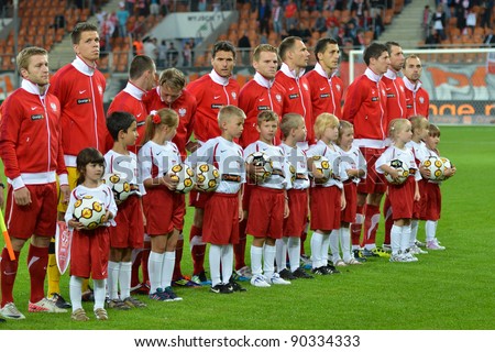 LUBIN, POLAND - AUGUST 10: Polish national team during the hymn before match Poland - Georgia (1:0) at the stadium Dialog Arena on August 10, 2011 in Lubin, Poland.