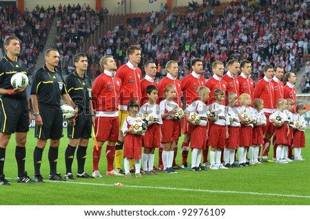 LUBIN, POLAND - AUGUST 10: Polish national team during the national anthem before match Poland - Georgia (1:0) at the stadium Dialog Arena on August 10, 2011 in Lubin, Poland.
