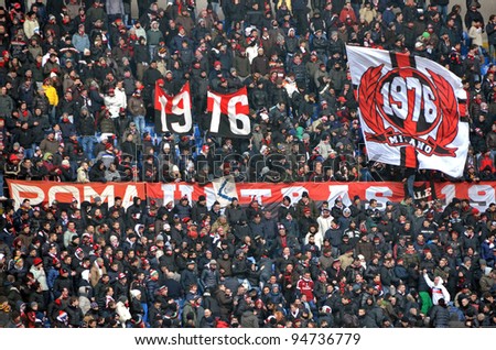 MILAN, ITALY - FEBRUARY 05: AC Milan fans cheer during a football match Sere A AC Milan - Napoli (0:0) at the stadium San Siro on February 05, 2012 in Milan, Italy.
