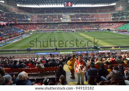 MILAN, ITALY - FEBRUARY 05: Seller snacks and football fans before match Sere A AC Milan - Napoli (0:0) at the stadium San Siro on February 05, 2012 in Milan, Italy.
