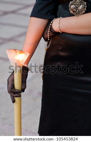 woman with candle Holy Week