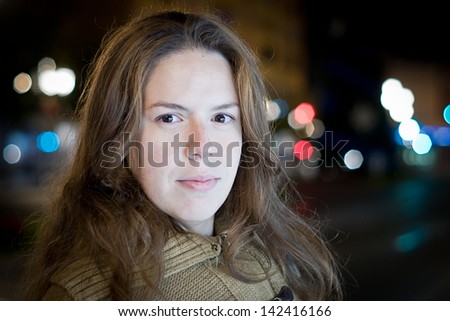 young woman at night bokeh