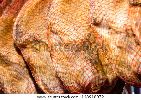 cured ham in a market