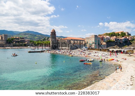 COLLIOURE, FRANCE - JULY  23: Tourists relax in the beach in the small village of Colliure, south France on July 23, 2014 in Collioure, France.