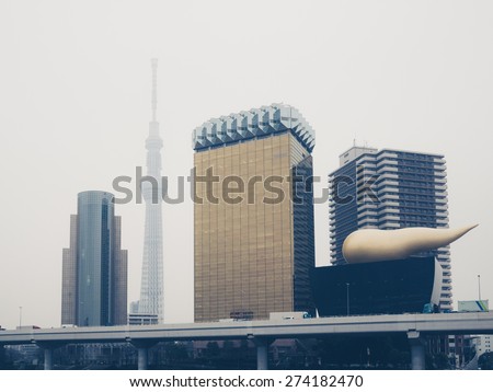 TOKYO, JAPAN - MARCH 18: Tokyo Skytree and Asahi Beer Hall  along the Sumida River on March 18, 2015 in Tokyo, Japan.
