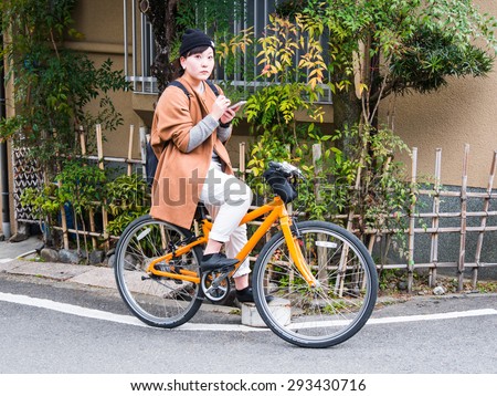 KYOTO, JAPAN - MARCH 24: Unidentified woman in a typical street on March 24, 2015 in Kyoto, Japan. Kyoto is also known as the City of Ten Thousand Shrines.