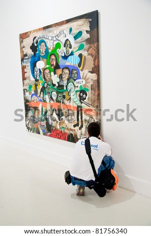 MALAGA,SPAIN - JUNE 11: People look at painting galleries at CAC (Contemporary Art Center),international exhibition of modern and contemporary art on June 11, 2010 in Malaga, Spain