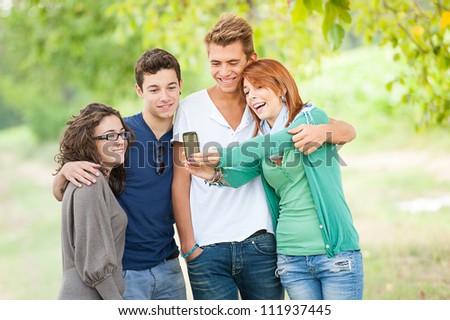 Group of teenagers posing for a group photograph